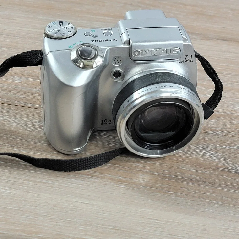 Olympus SP-510UZ 7.1 Megapixel Digital Camera 10x Optical Zoom Silver No Cap